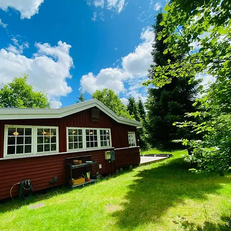 Red Wooden House In The Middle Of Frederiksvaerks Nature *